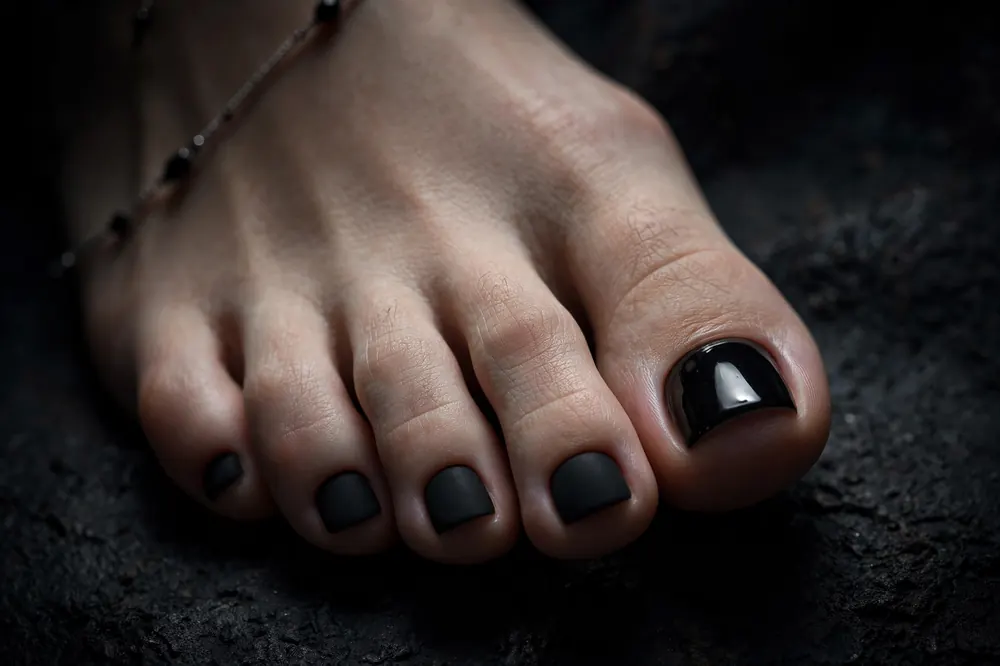Bold matte black polish with glossy top coat contrast